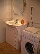 Bathroom with washing machine in Comfort Apartments for longer trips in Budapest